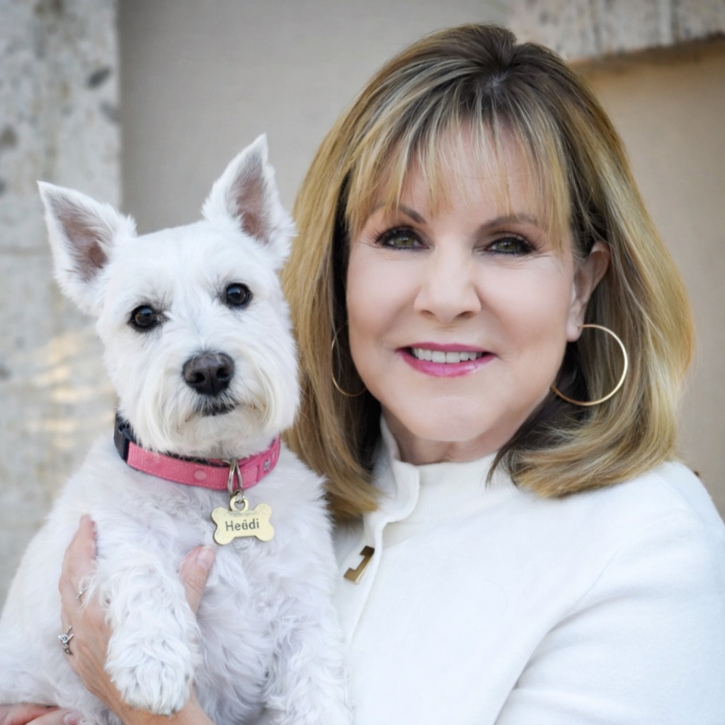 Ginny Jontes, founder of Heidi's Village, with Heidi the white schnauzer